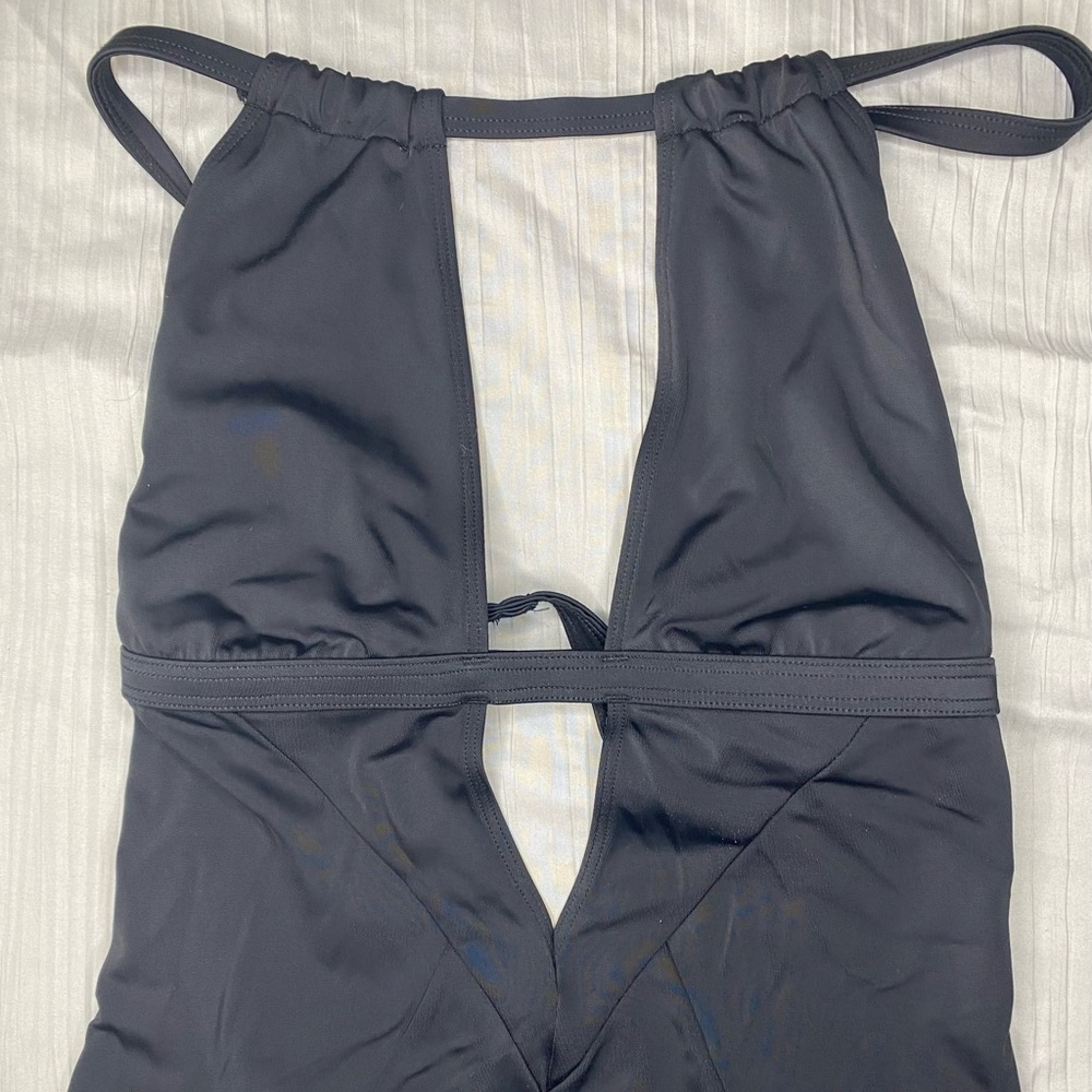 Women’s size medium one- piece swimsuit.